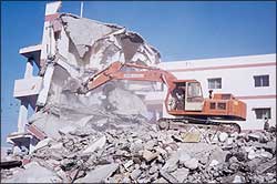 The army has begun demolishing damaged buildings