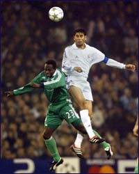 Fernando Hierro (R) and Emmanuel Olisadebe 