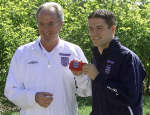 Sven Goran Eriksson (L) hands the captain's arm band to Michael Owen. 