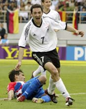 Oliver Neuville celebrates scoring the match-winner against Paraguay.