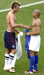 David Beckham and Roberto Carlos exchange jerseys after the match.