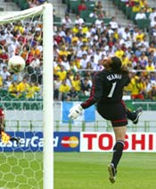 David Seaman watches Ronaldinho's free-kick dip into the goal.